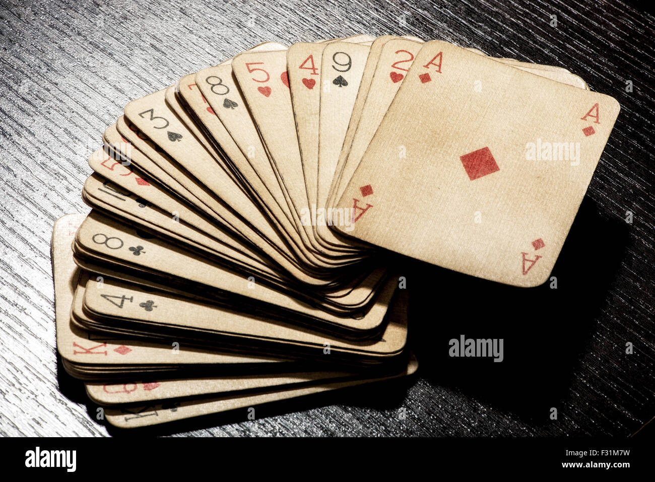 Deck of grungy dirty discolored old playing cards Stock Photo
