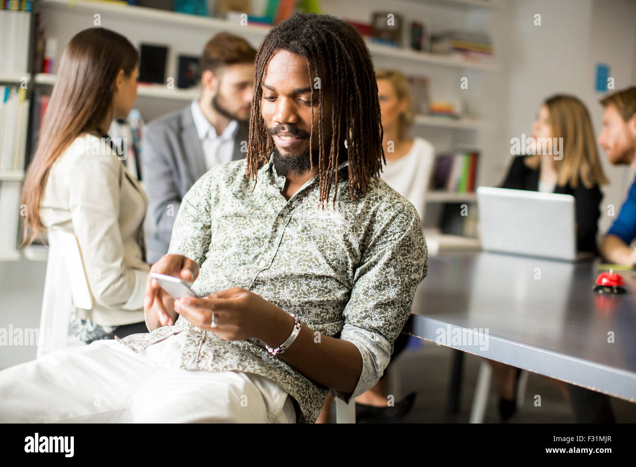 Young people in the office Stock Photo - Alamy
