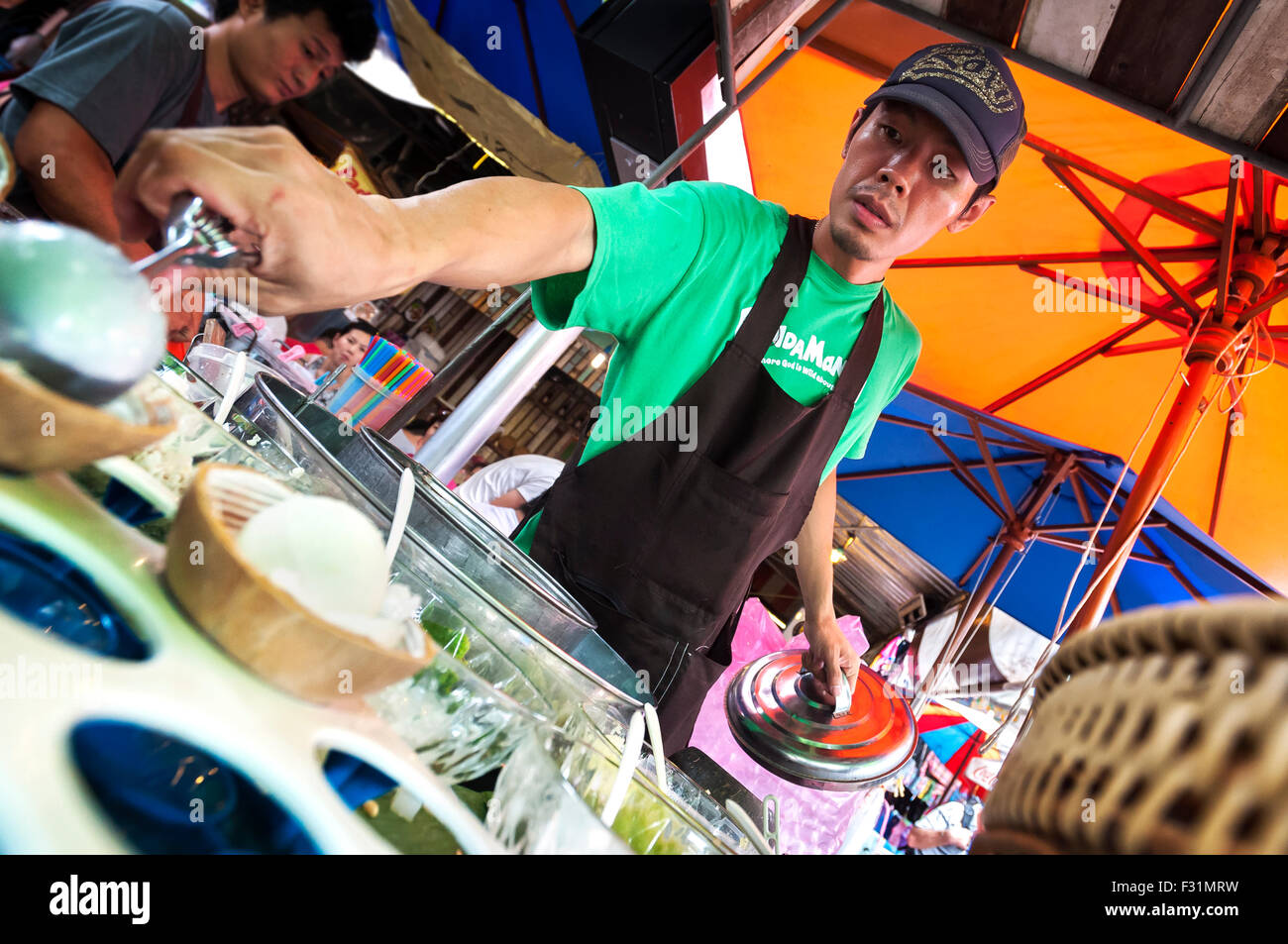 Guy serves coconut ice cream hires stock photography and images Alamy