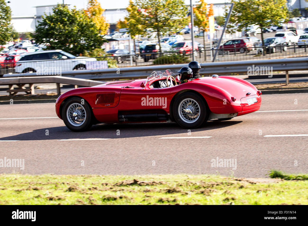 A vintage 1953 Jaguar C-Type replica sports car convertible travelling along the Kingsway West Dual Carriageway in Dundee, UK Stock Photo