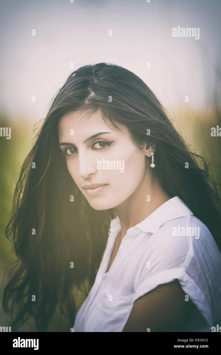 Portrait of a beautiful young woman outdoors Stock Photo - Alamy