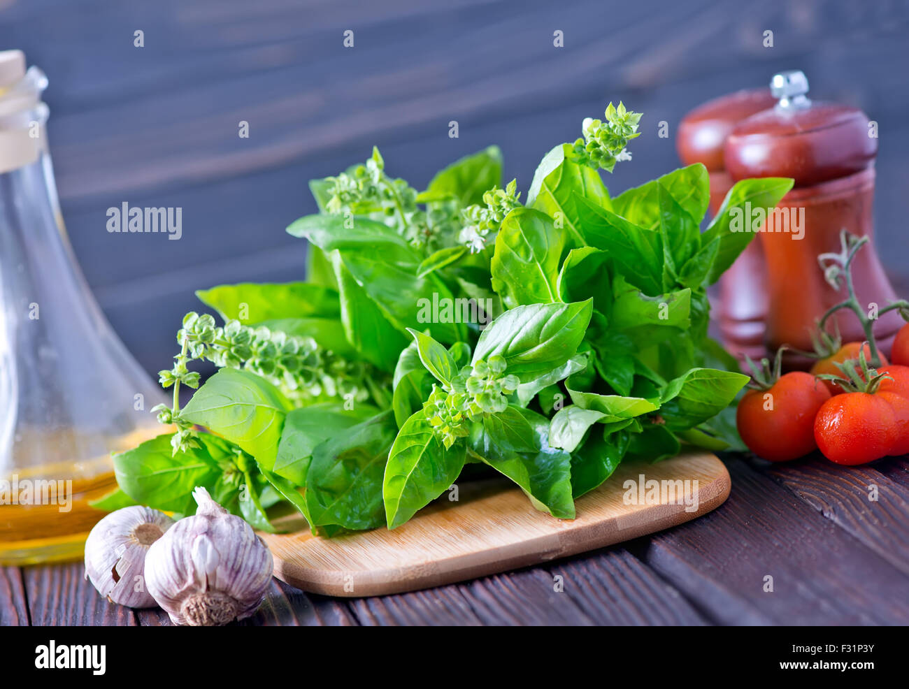 fresh basil on board and on a table Stock Photo - Alamy