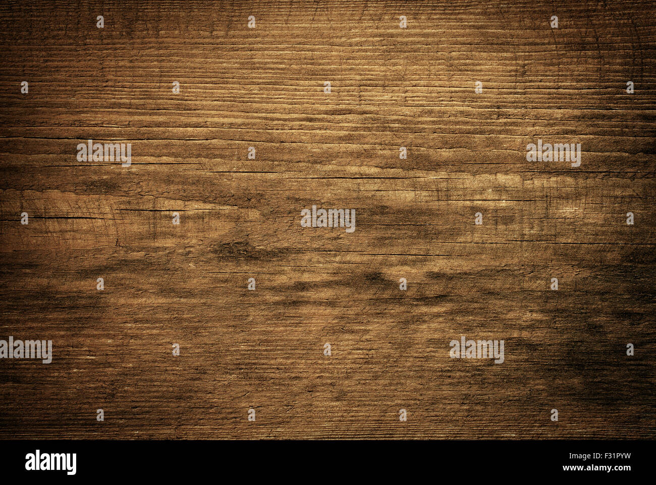 Dark brown scratched wooden cutting board. Wood texture Stock Photo