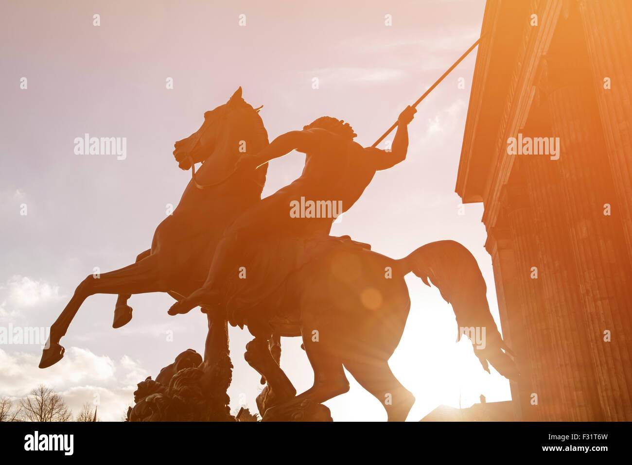 Horse statue at the door of the Altes Museum (Old Museum) in Berlin at sunset, Germany, toned image. Stock Photo