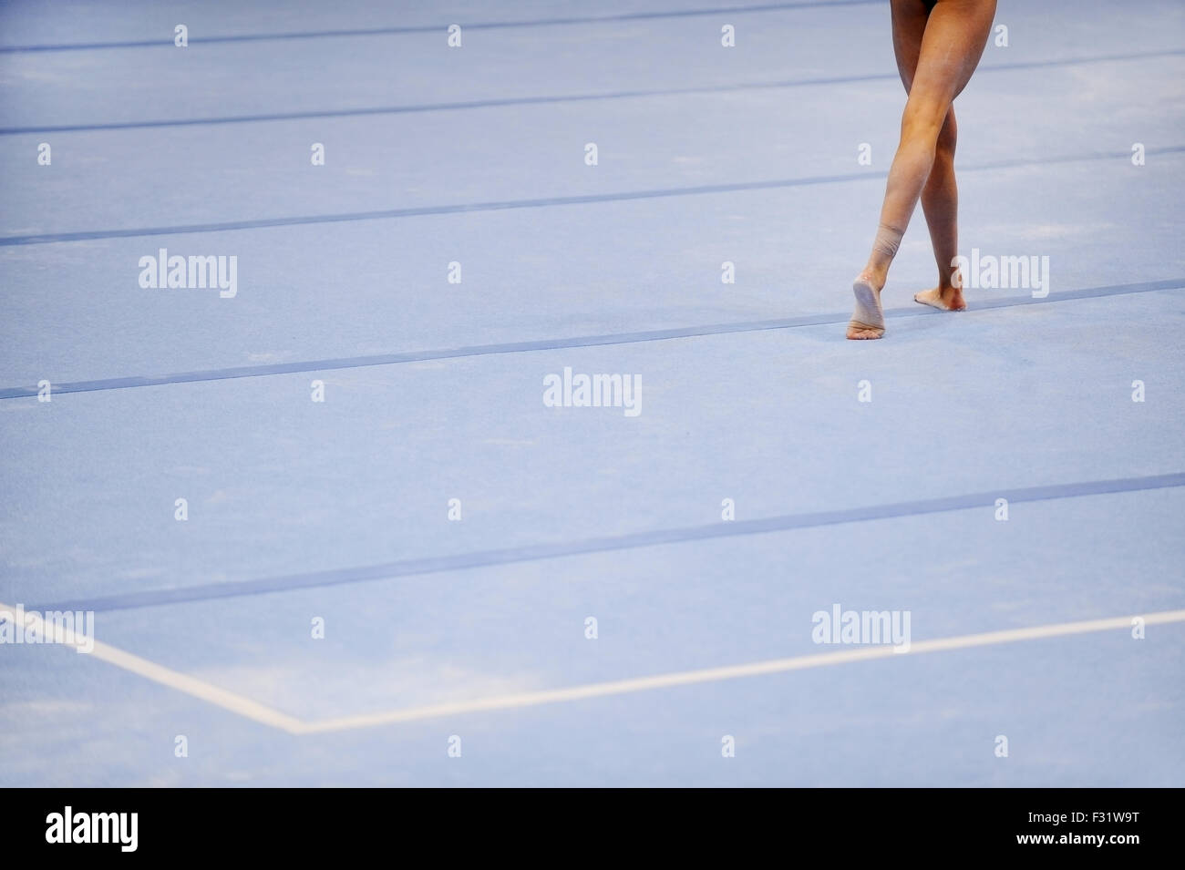 Feet of gymnast are seen on the floor exercise during gymnastics competition Stock Photo Alamy