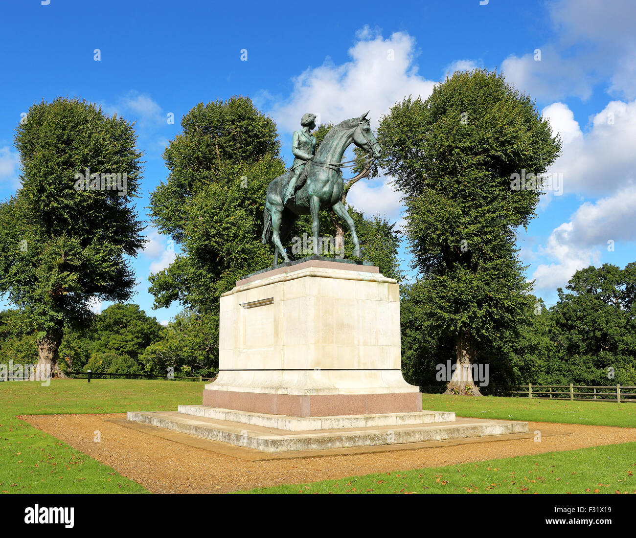 Statue of Queen Elizabeth II on Horseback set on a plinth in Windsor Great Park Stock Photo