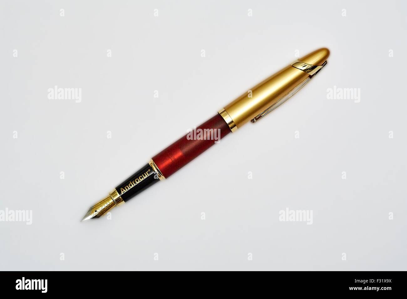 The Gold Ink Pen Is Mightier than the Sword Iridium Point Made in Germany, Stock Photo