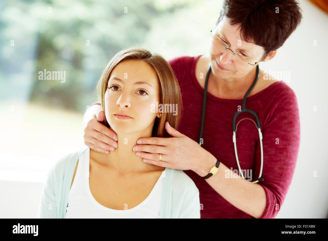 Doctor examining patient Stock Photo