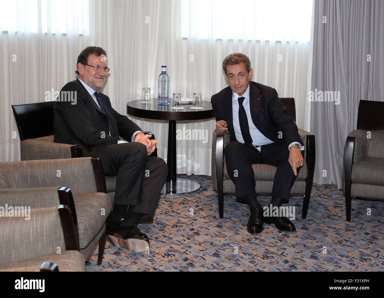 BARCELONA, SPAIN - SEPTEMBER 25: French former president Nicolas Sarkozy (R) and Spanish Prime Minister Mariano Rajoy (C) smile as they pose before the Catalonia's Popular Party (PP) final campaign meeting for the Catalan regional election, in Barcelona on September 25, 2015. Catalonia goes to the poles on September 27 with today ending one of the most intense electoral campaign ever known in post-Franco Spain as Catalonia plays its independence. in Barcelona, Spain, Friday, Sept. 25, 2015. Catalans vote Sunday in regional parliamentary elections that the breakaway camp hopes will give them a Stock Photo