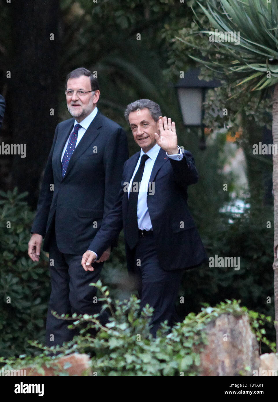BARCELONA, SPAIN - SEPTEMBER 25: French former president Nicolas Sarkozy (R) and Spanish Prime Minister Mariano Rajoy (C) smile as they pose before the Catalonia's Popular Party (PP) final campaign meeting for the Catalan regional election, in Barcelona on September 25, 2015. Catalonia goes to the poles on September 27 with today ending one of the most intense electoral campaign ever known in post-Franco Spain as Catalonia plays its independence. in Barcelona, Spain, Friday, Sept. 25, 2015. Catalans vote Sunday in regional parliamentary elections that the breakaway camp hopes will give them a Stock Photo