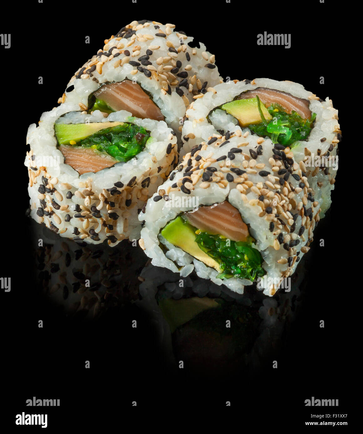 fresh made Japanese sushi rolls with avocado and salmon Stock Photo