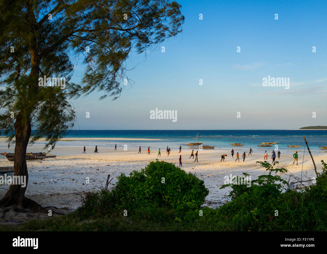Teenagers Playing Football On Beach Stock Photos Teenagers
