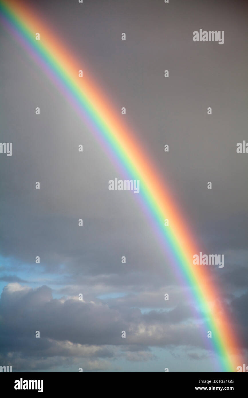 Rainbow against dark sky hi-res stock photography and images - Alamy