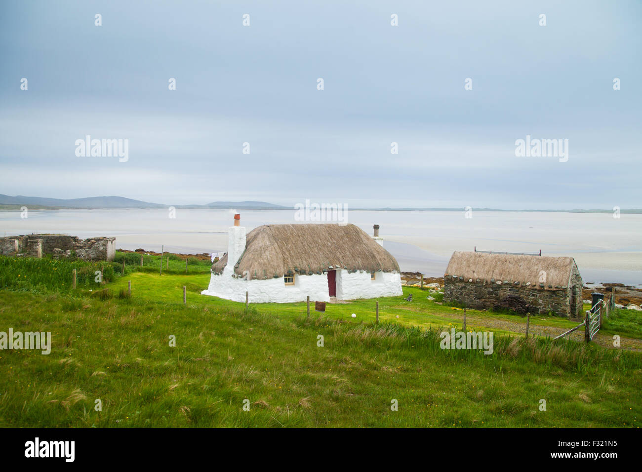 A Traditional Whitewashed Thatched Cottage On North Uist Outer