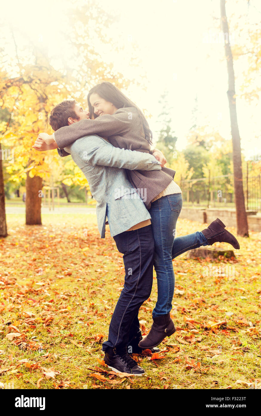 smiling couple hugging in autumn park Stock Photo - Alamy