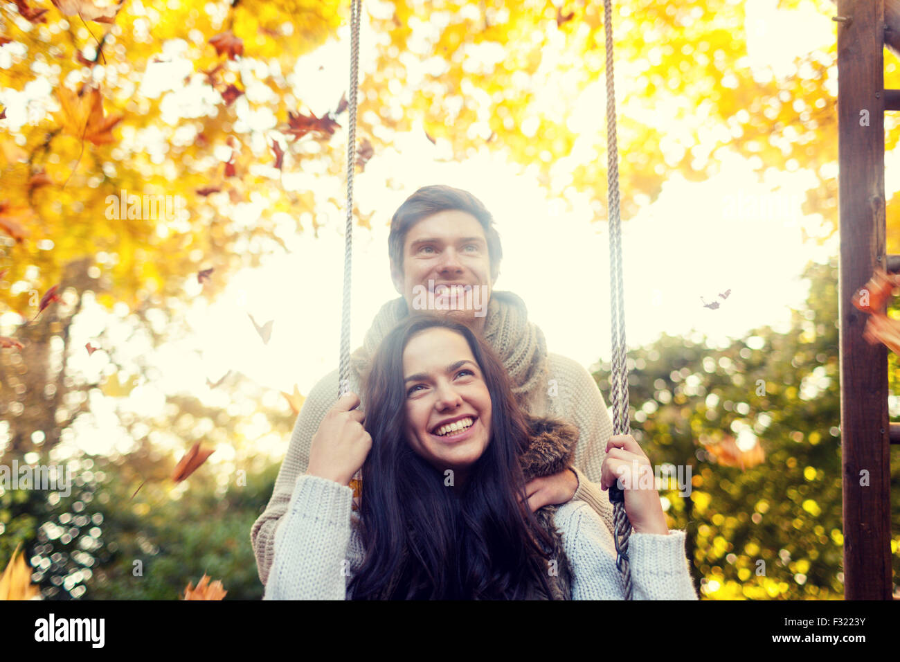 smiling couple hugging in autumn park Stock Photo - Alamy