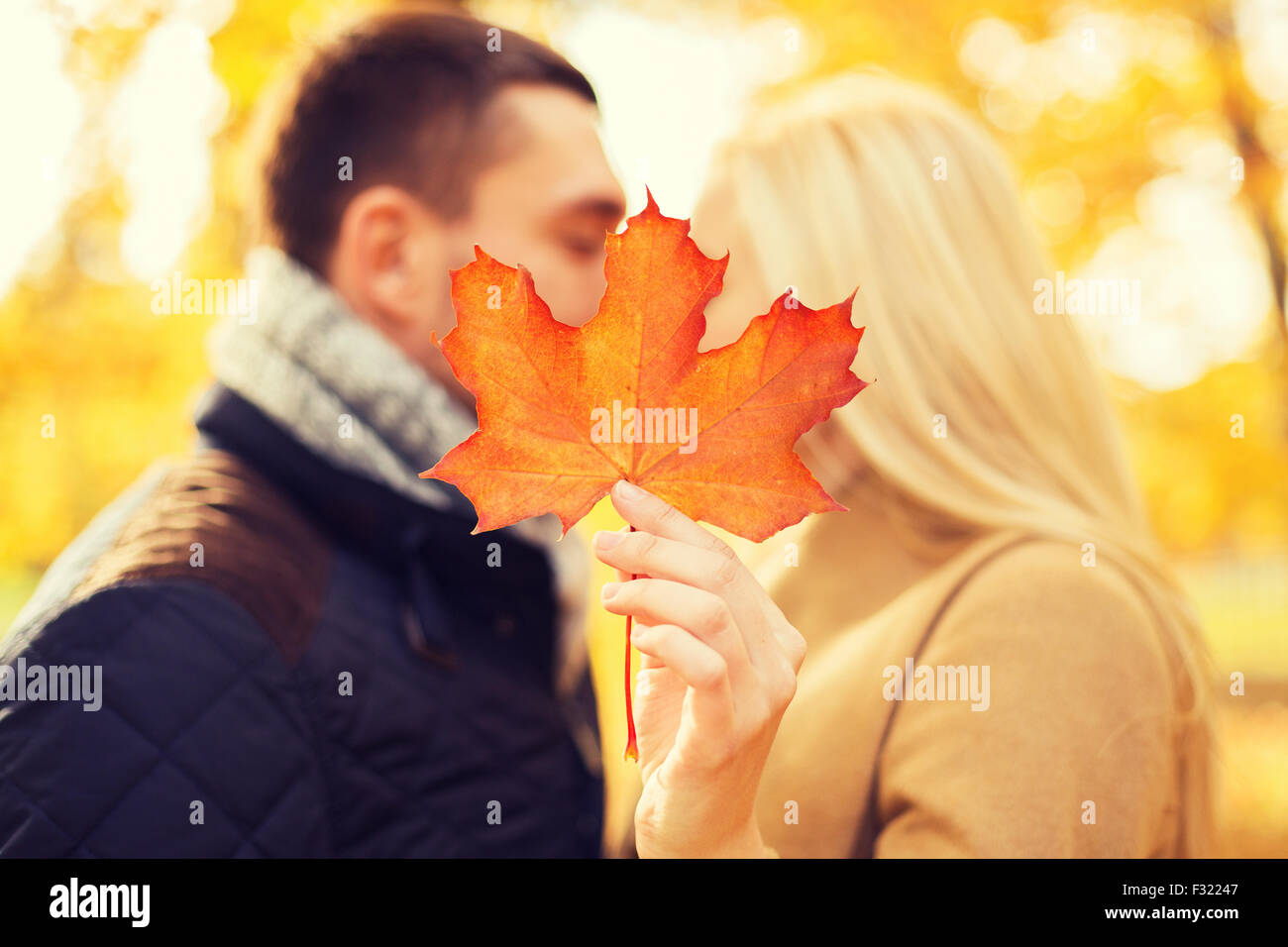 close up of couple kissing in autumn park Stock Photo - Alamy