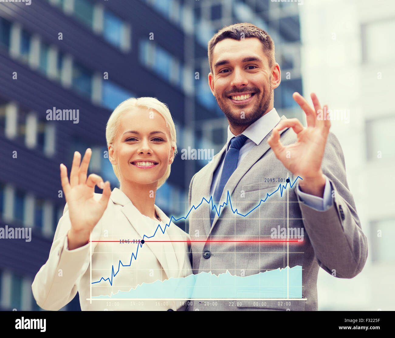 smiling businessmen standing over office building Stock Photo - Alamy