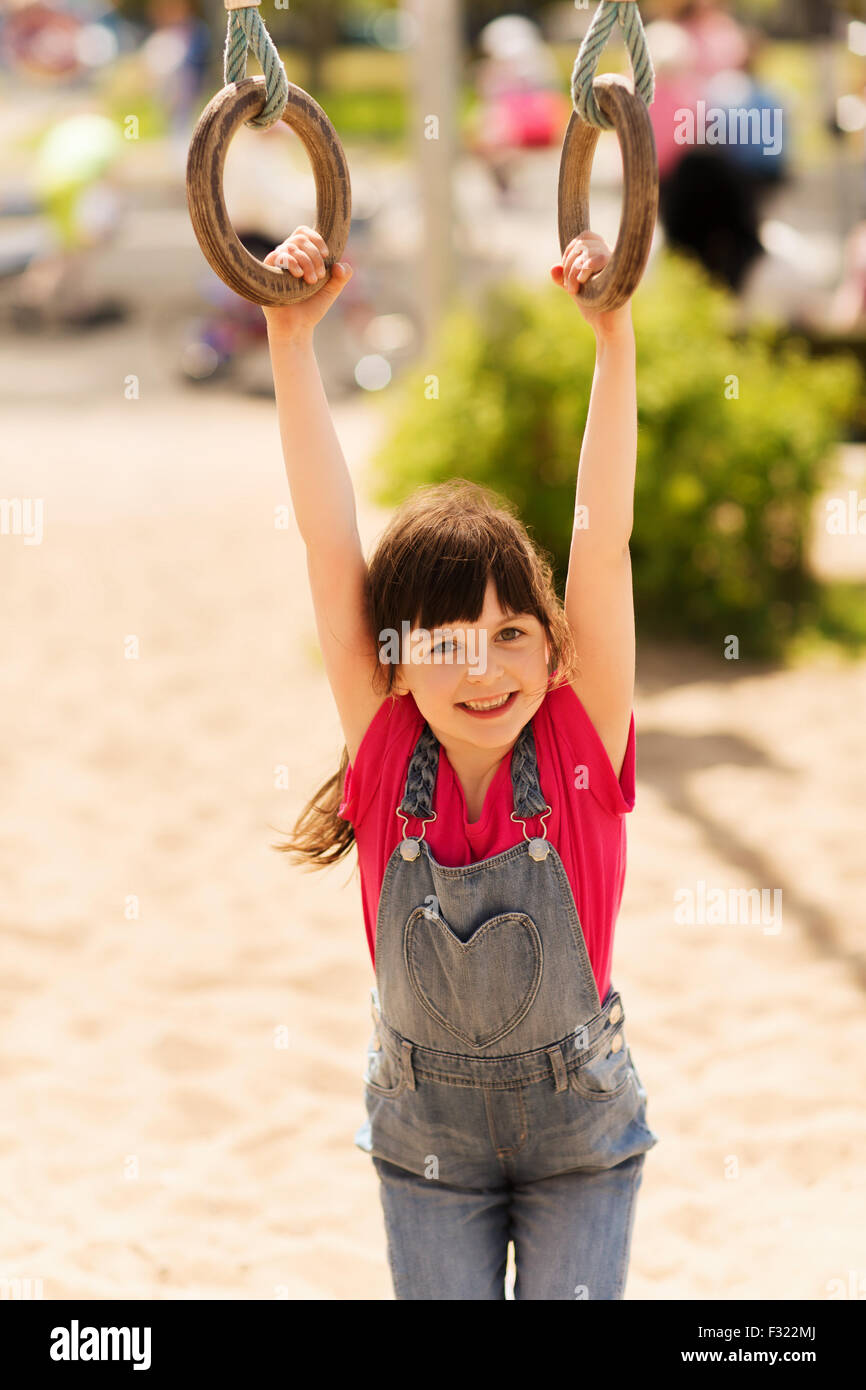 happy little girl on children playground Stock Photo - Alamy