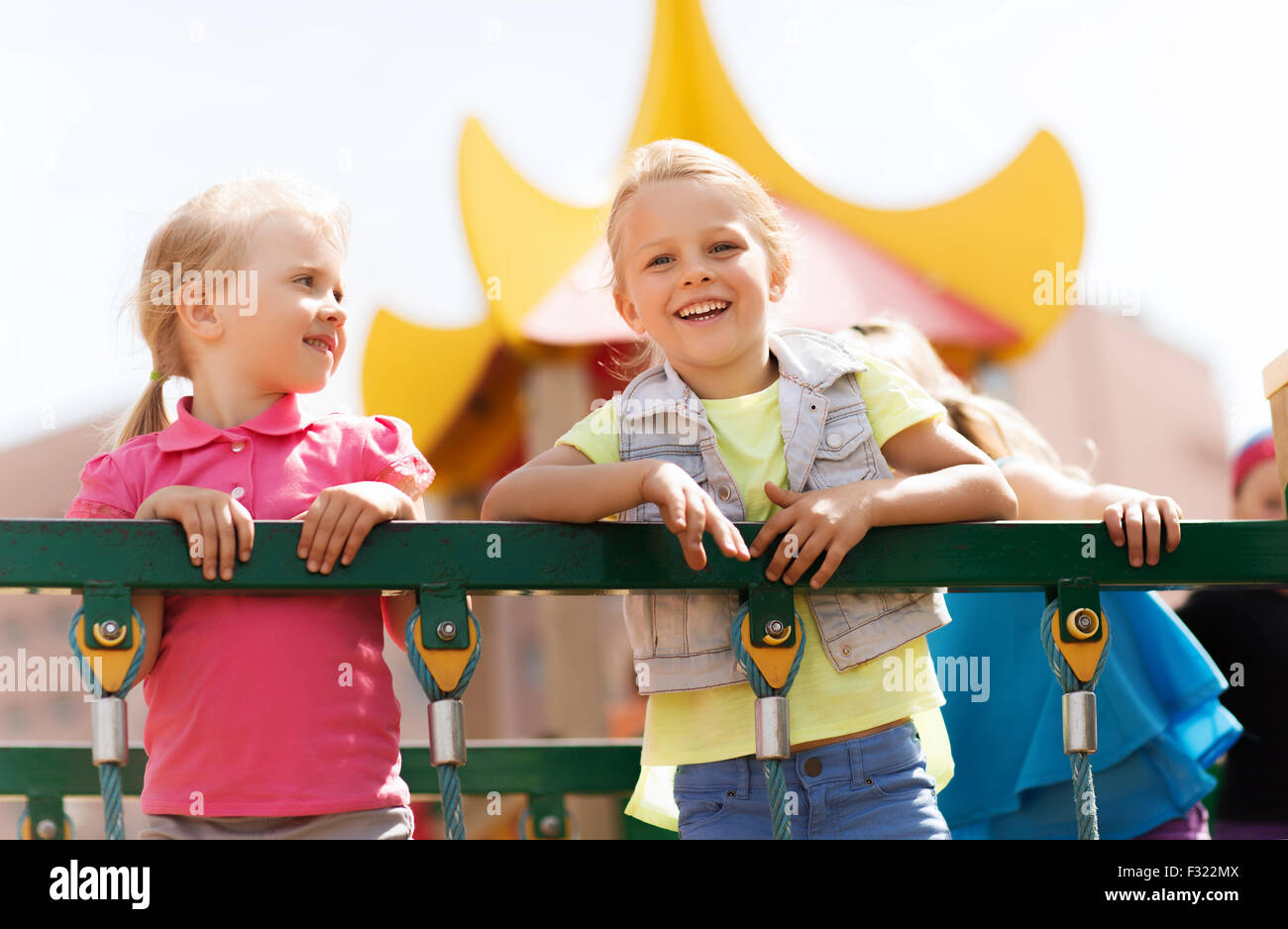 happy little girls on children playground Stock Photo - Alamy