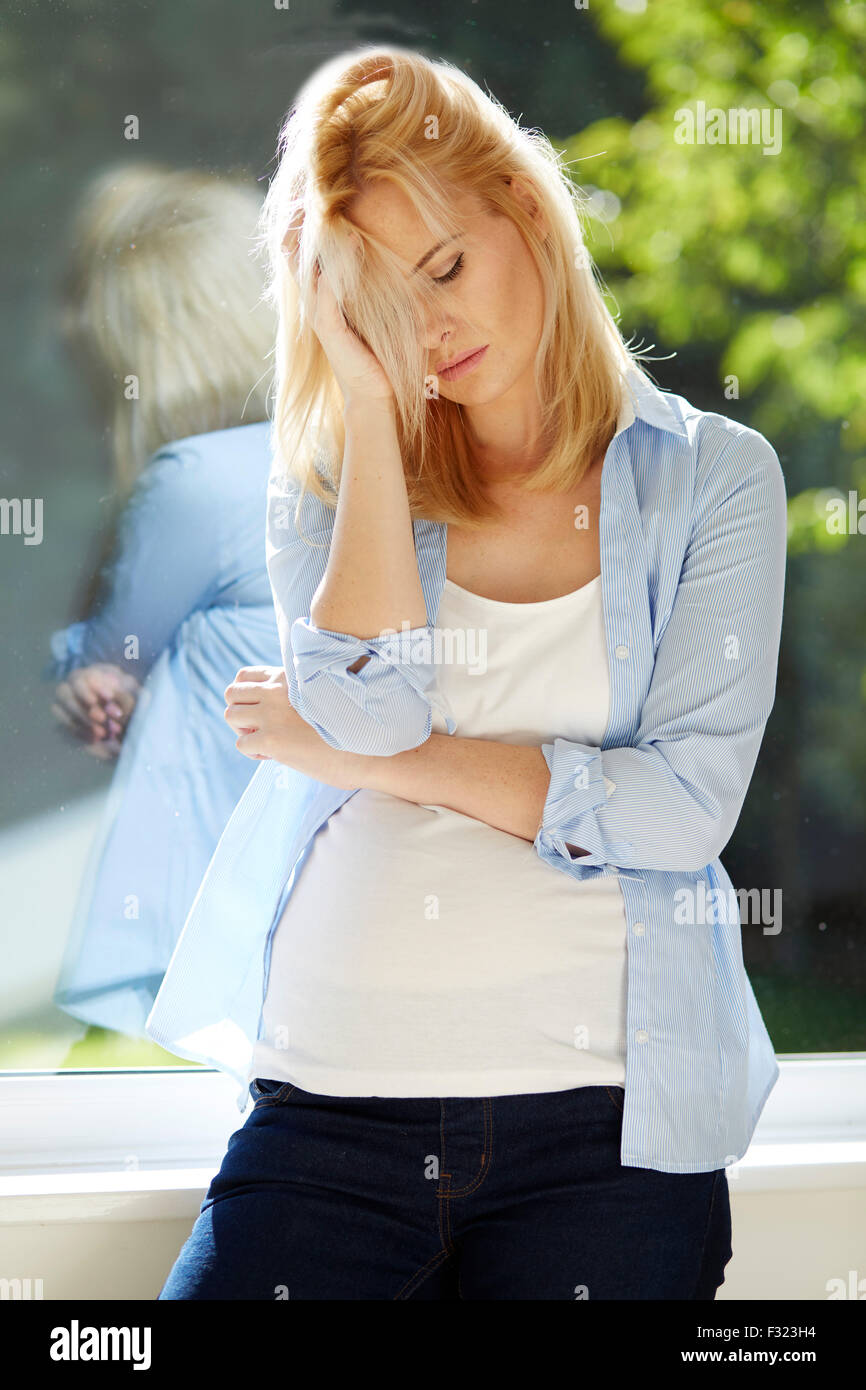 Worried pregnant woman Stock Photo