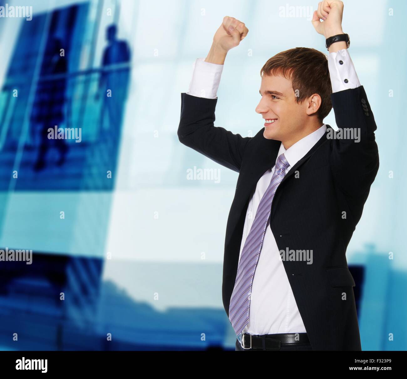 Young happy businessman Stock Photo - Alamy
