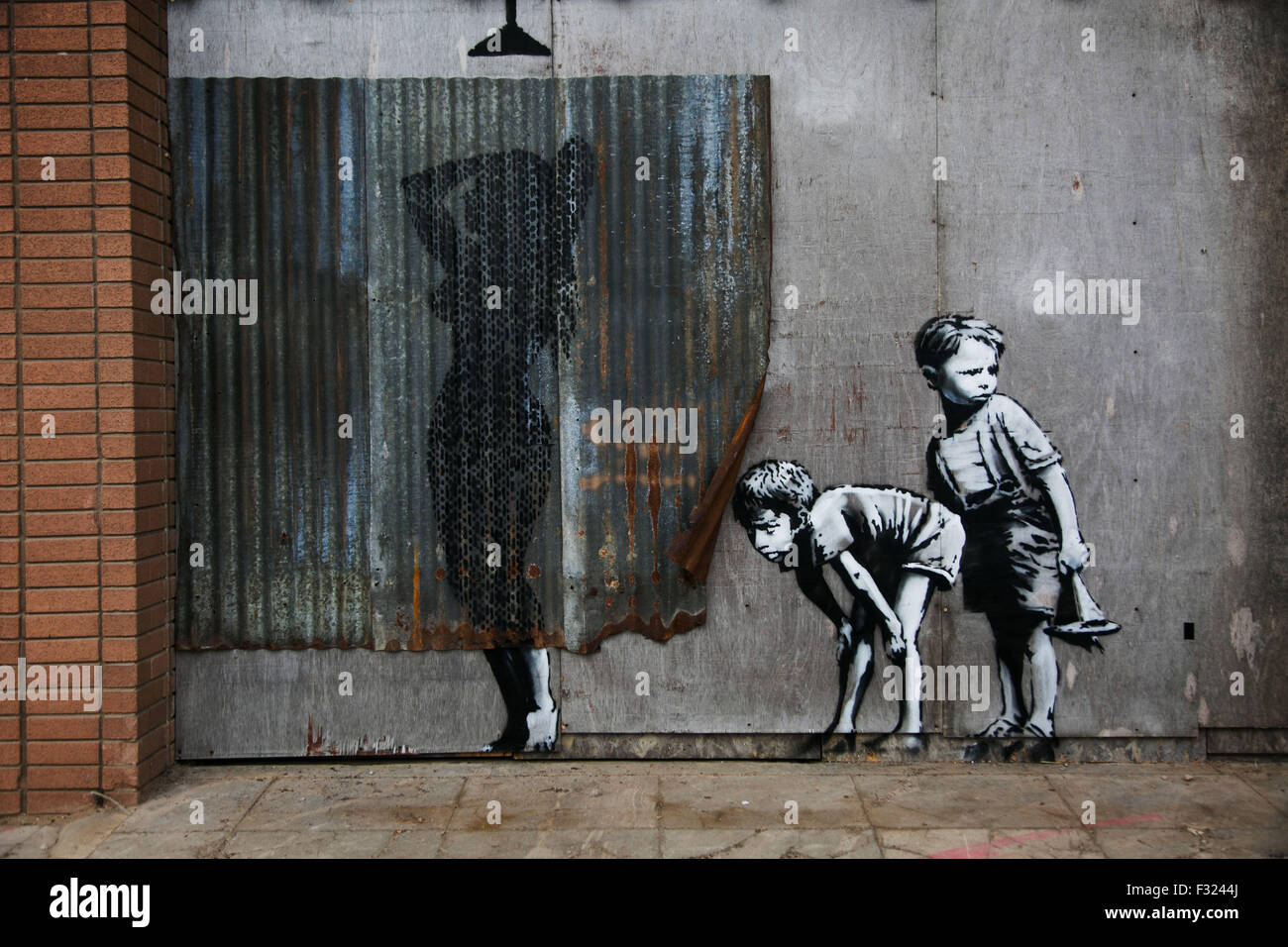 Art work by Banksy. On the first day the show is open only a