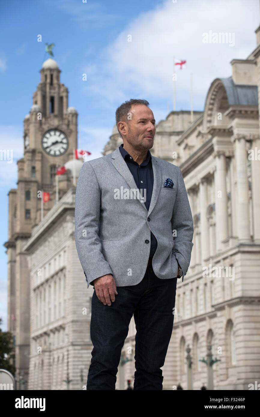 Former left-wing British politician, Derek Hatton, pictured in his home city of Liverpool, with the iconic Liver Building in the background. Hatton is a former politician, broadcaster, property developer, businessman and after-dinner speaker. He gained national prominence as a local politician in Liverpool during the 1980s, where he was Deputy Leader of the City Council, and a member of the Trotskyist Militant group which brought him into conflict with the Labour Party and the then Conservative government of Margaret Thatcher. Stock Photo
