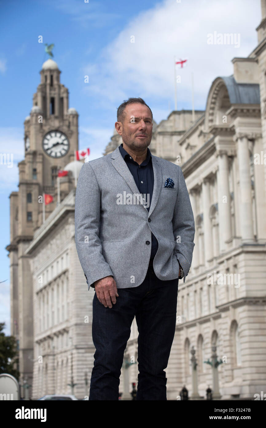 Former left-wing British politician, Derek Hatton, pictured in his home city of Liverpool, with the iconic Liver Building in the background. Hatton is a former politician, broadcaster, property developer, businessman and after-dinner speaker. He gained national prominence as a local politician in Liverpool during the 1980s, where he was Deputy Leader of the City Council, and a member of the Trotskyist Militant group which brought him into conflict with the Labour Party and the then Conservative government of Margaret Thatcher. Stock Photo