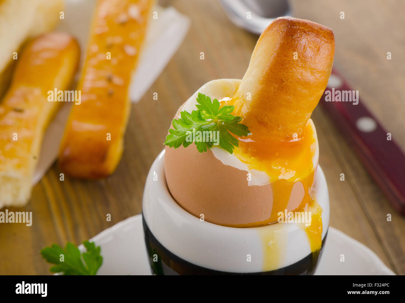 Soft boiled egg for Breakfast  served with bread. Selective focus Stock Photo