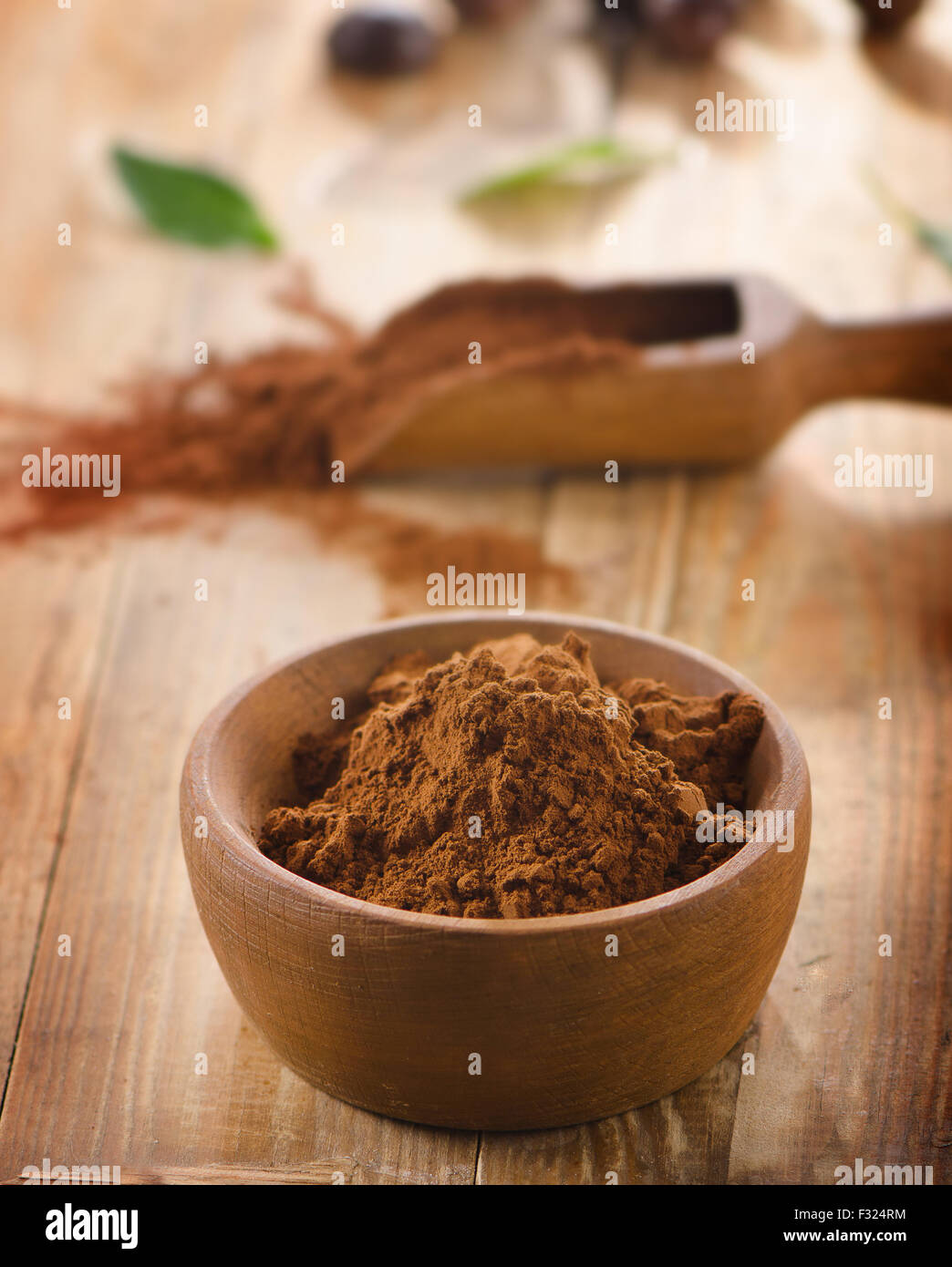 Cacao powder in a wooden bowl. Selective focus Stock Photo