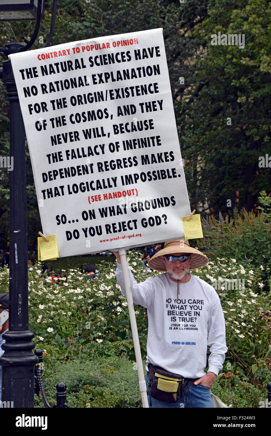 An unusual protester in Washington Square Park in Manhattan claiming to have proof of the existence of God. Stock Photo
