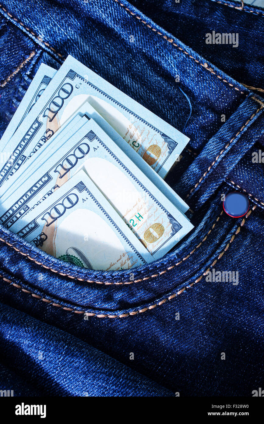 dollars in jeans pocket, jeans background Stock Photo - Alamy