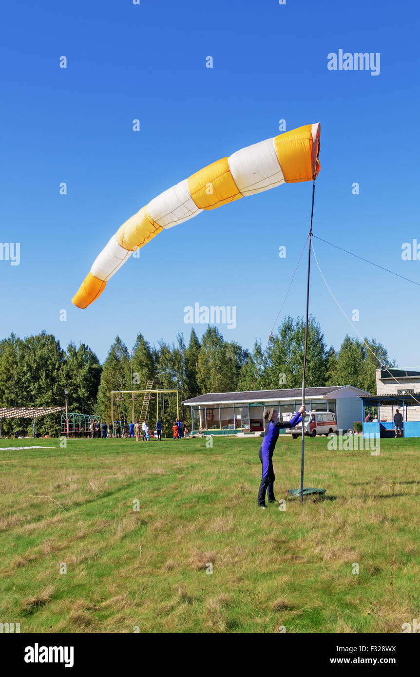 Parachutists - 2014. Assembly of a conical textile tube ( windsock) for definition of the wind direction. Stock Photo