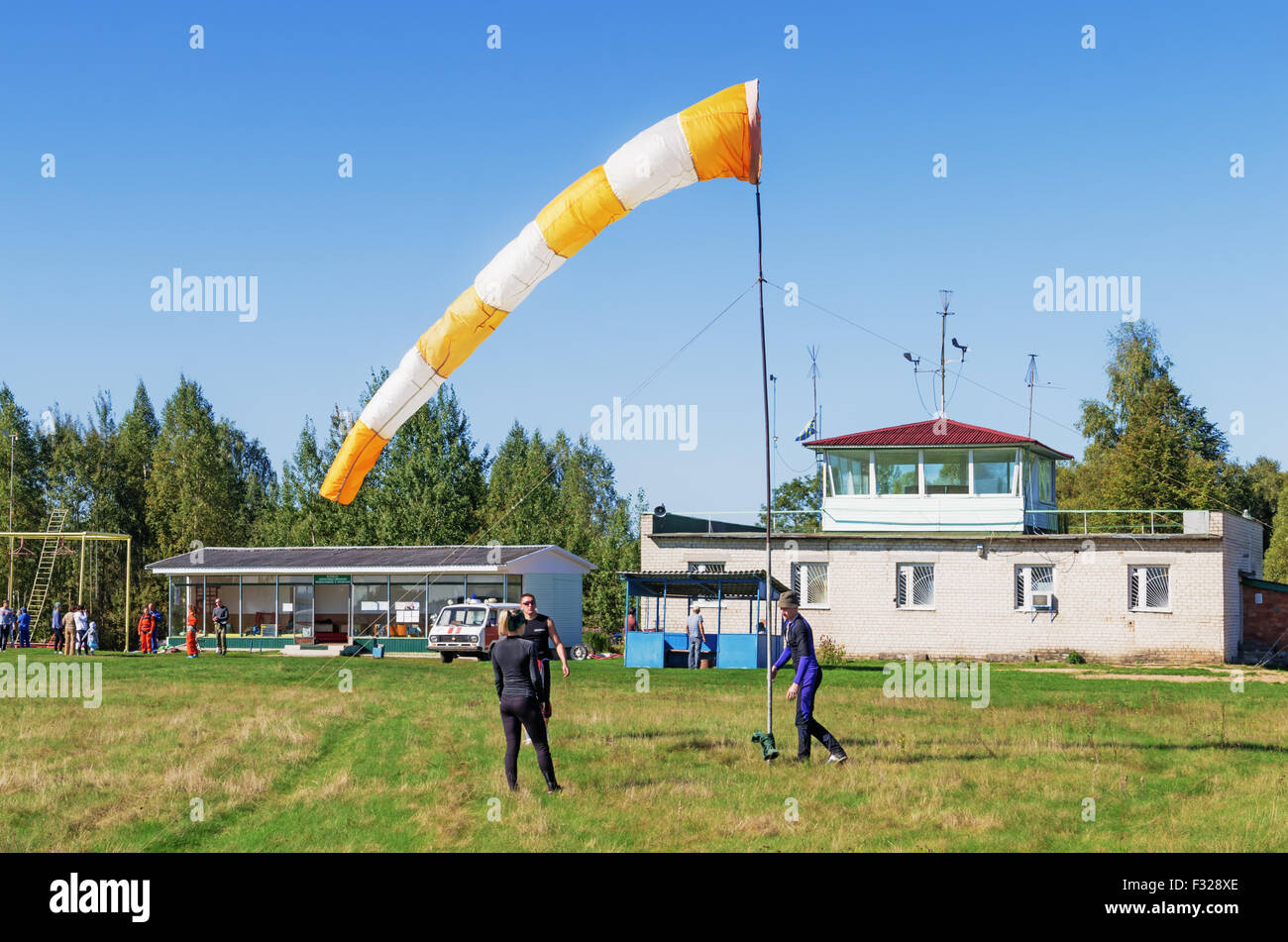 Parachutists - 2014. Assembly of a conical textile tube ( windsock) for definition of the wind direction. Stock Photo