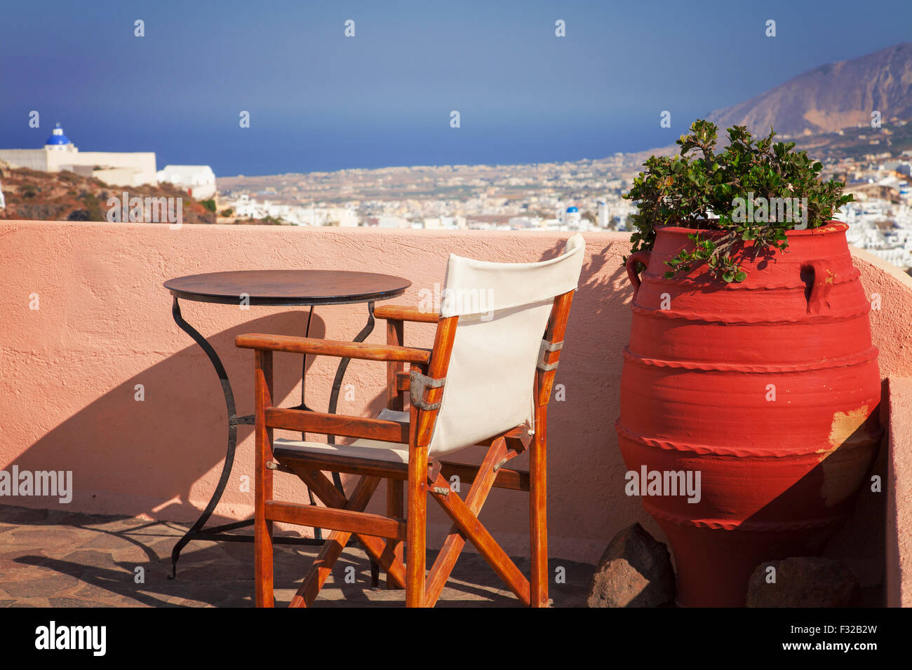 Image of a sun terrace with a beautiful view of Santorini Island, Greece. Stock Photo