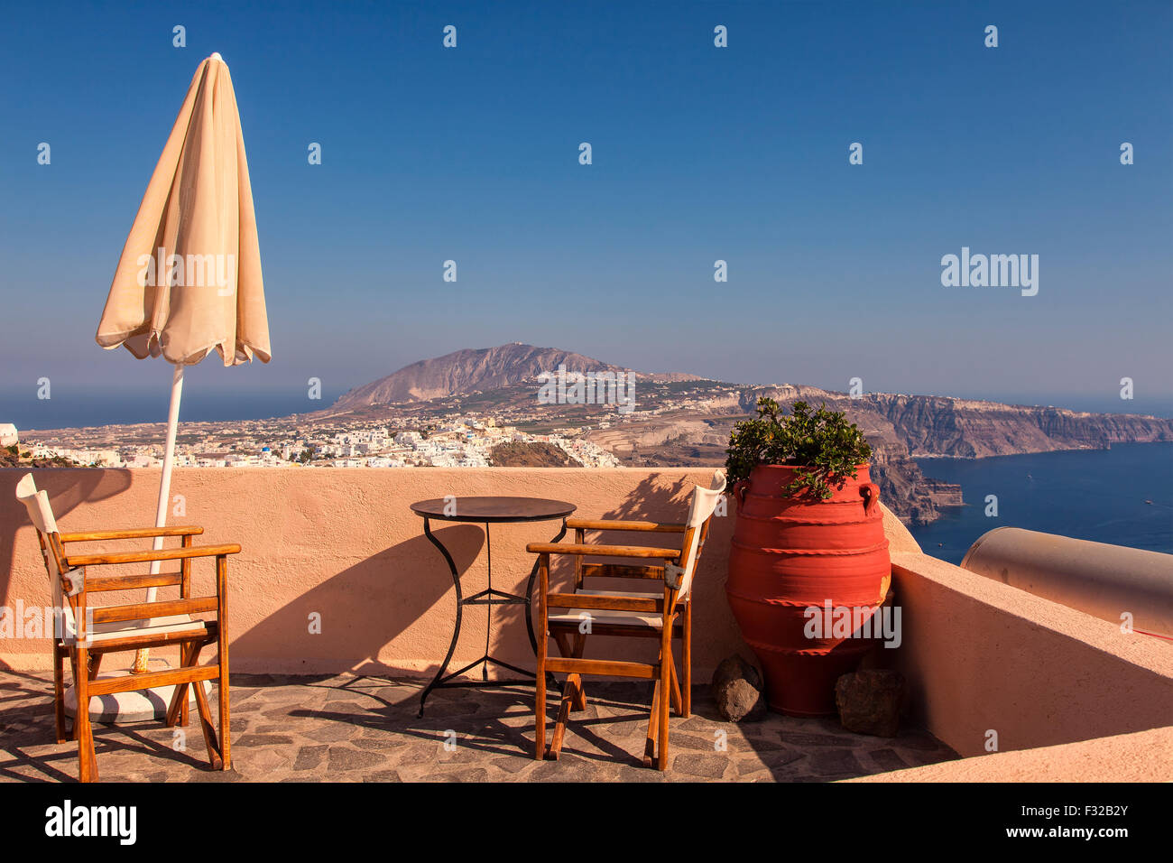 Image of a sun terrace with a beautiful view of Santorini Island, Greece Stock Photo