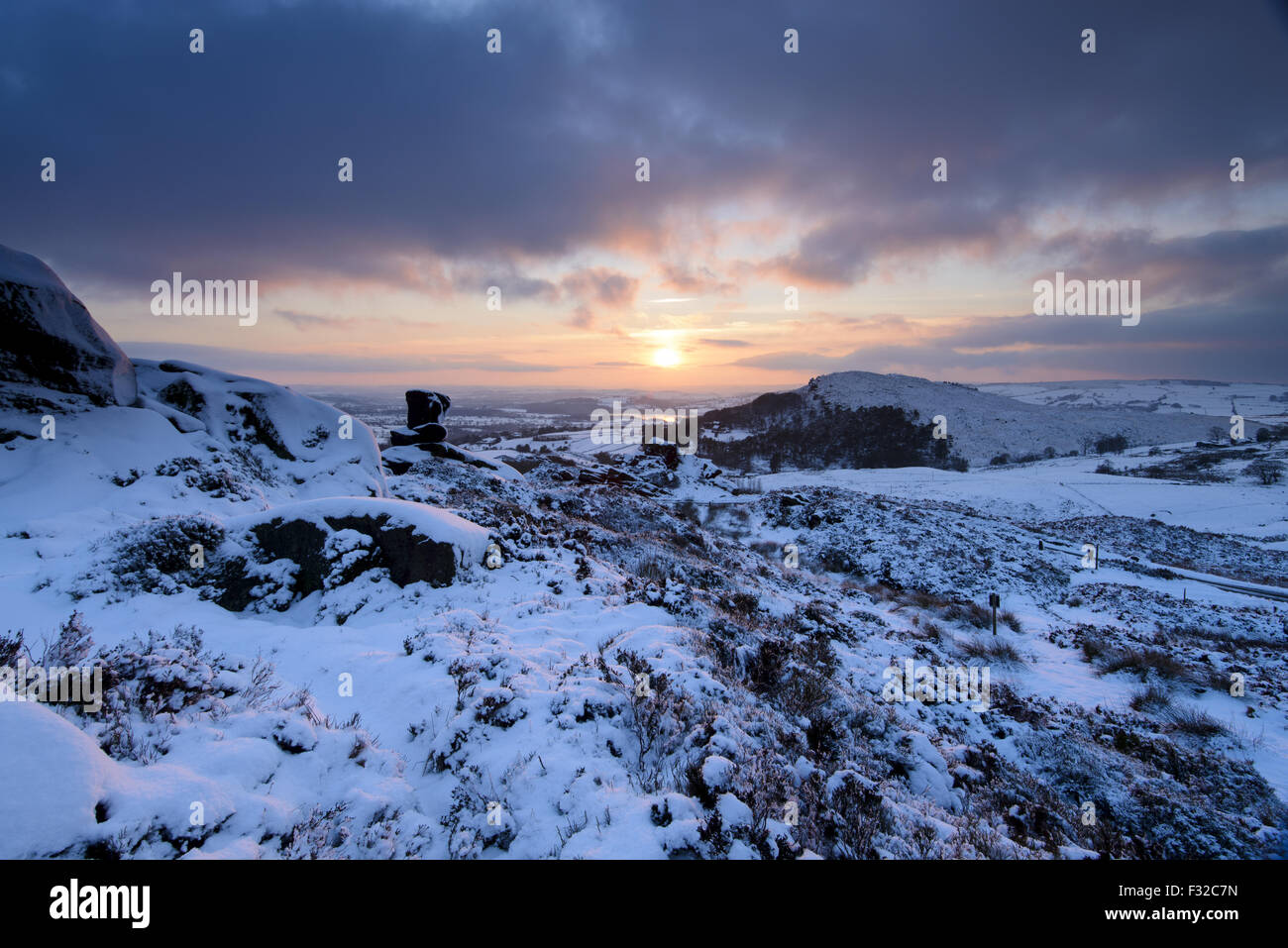 View of snow covered gritstone escarpment at sunset, Ramshaw Rocks, North Staffordshire Moorlands, Peak District N.P., Staffordshire, England, December Stock Photo