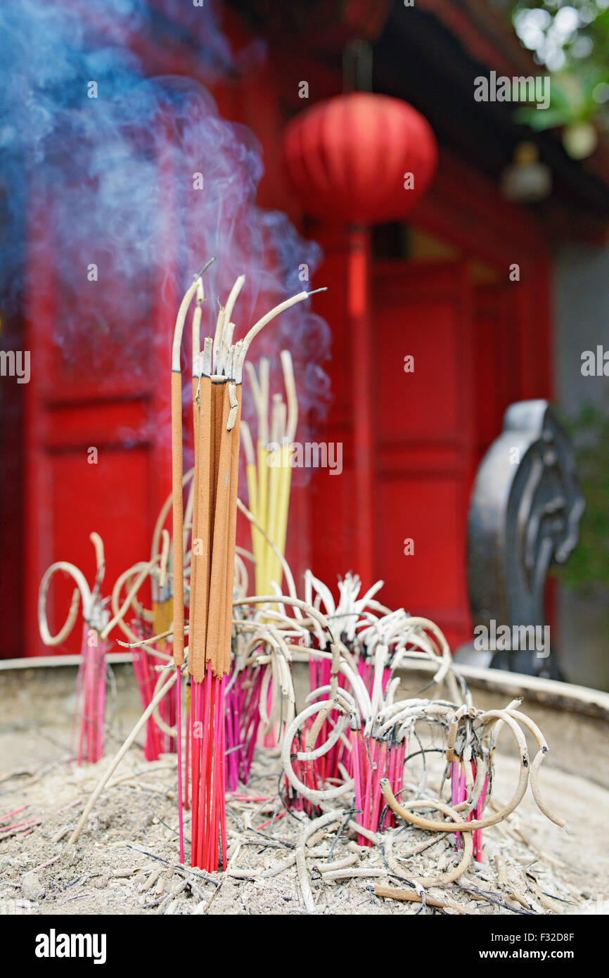 Incense sticks burning at a Buddhist temple in Hoan Kiem lake, Hanoi