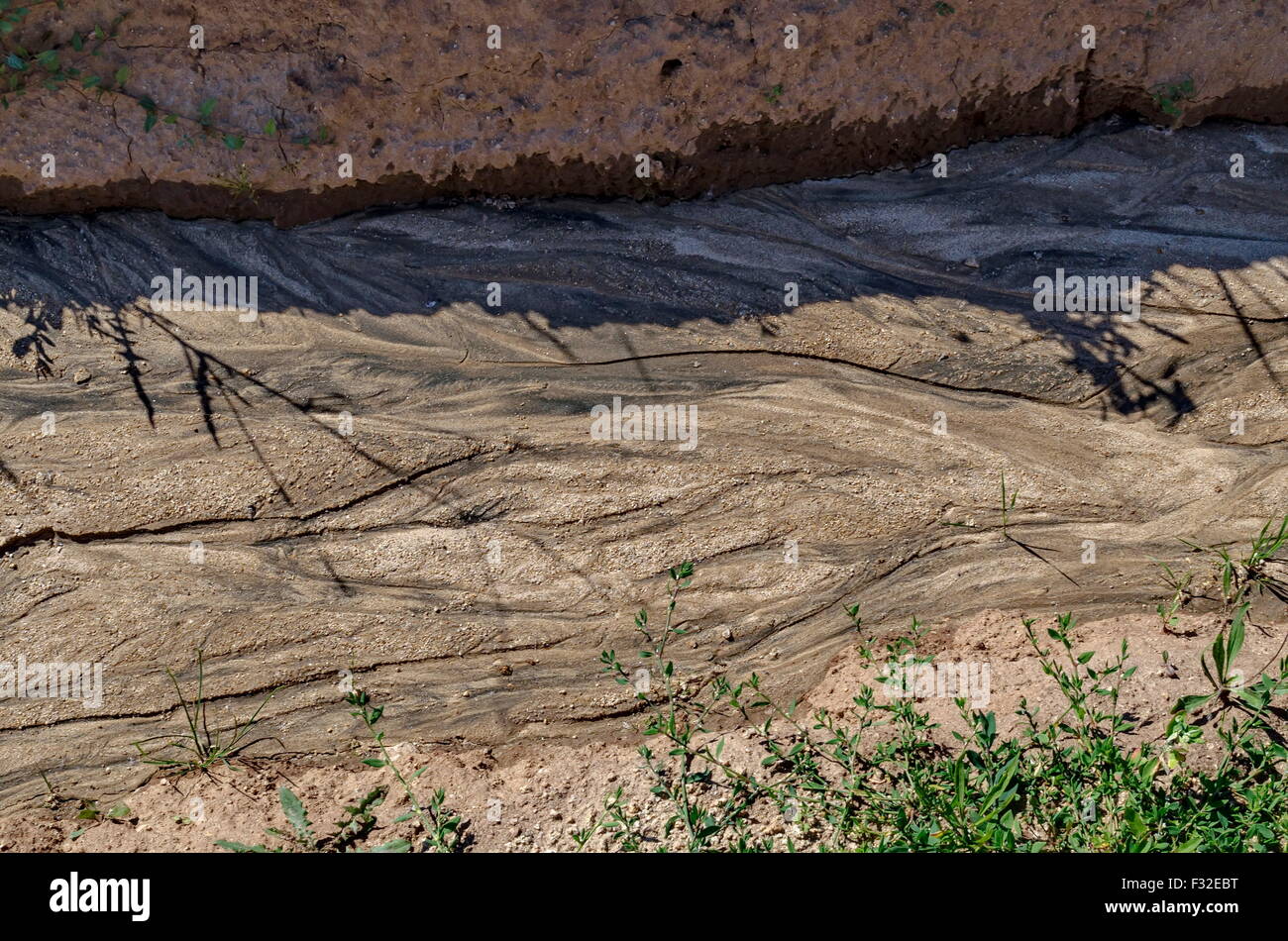 Dry land with drawing after flood rain in the field, Plana mountain