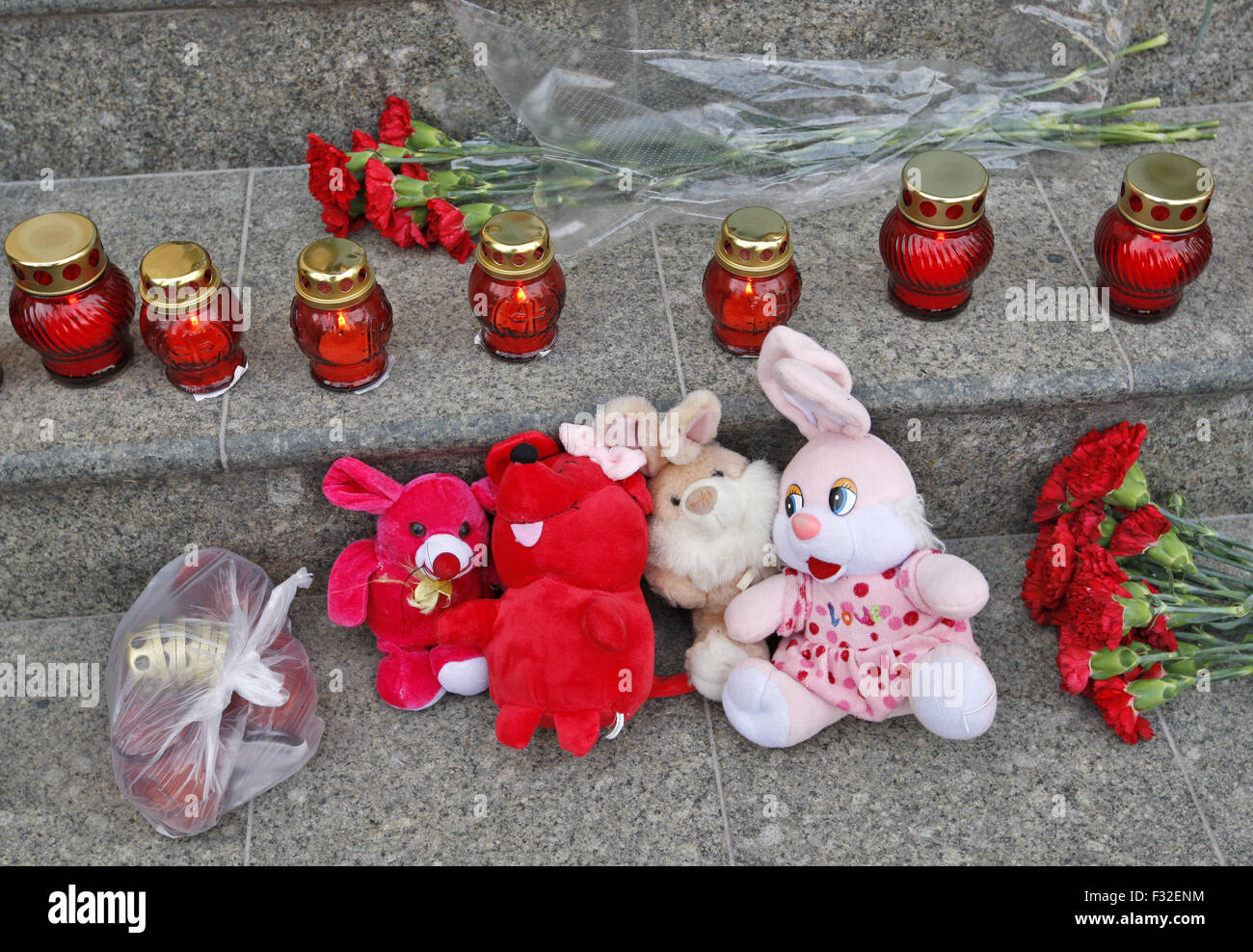 Flowers and toys in front of the the Netherlands embassy in memory of the people who died in the crash of Malaysian Airlines flight MH17, during a rally called 'Exorcism for the UN' with the requirement to establish an international tribunal to investigate the circumstances of the crash of Malaysian Airlines flight MH17 and to exclude Russia from the United Nations. All 298 passengers and crew, the majority Dutch, died on July 17, 2014 when the Malaysia Airlines Boeing 777, on a flight between Amsterdam and Kuala Lumpur, was shot down over rebel-held east Ukraine during heavy fighting between  Stock Photo