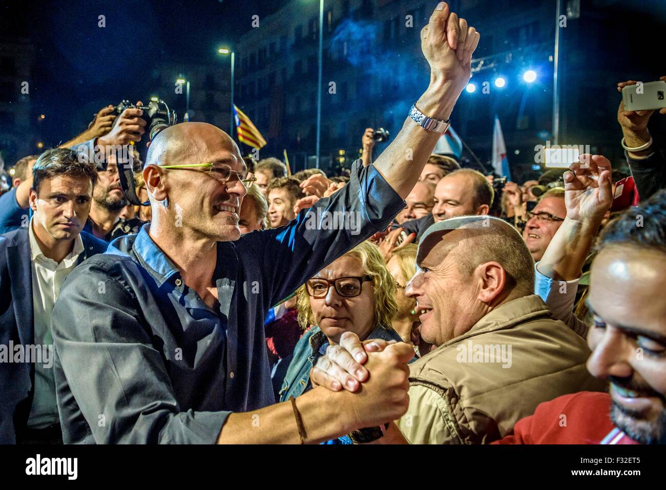 Barcelona, Spain. 27th Sep, 2015. RAUL ROMEVA, expert in international relations and number 1 of the pro-independence cross-party electoral list 'Junts pel Si' (Together for the yes) greets the crowd of supporters during the Election Night party atBarcelona's Mercat del Born. Credit:  matthi/Alamy Live News Stock Photo