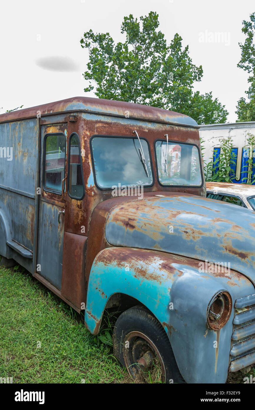 Antique delivery truck rusting in a lot Stock Photo Alamy