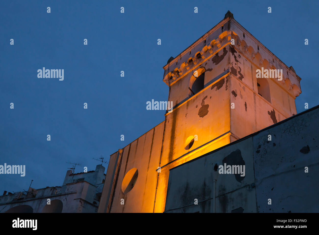 Santa Maria Assunta. Illuminated church facade over dark blue sky, Ischia Porto, Italy Stock Photo