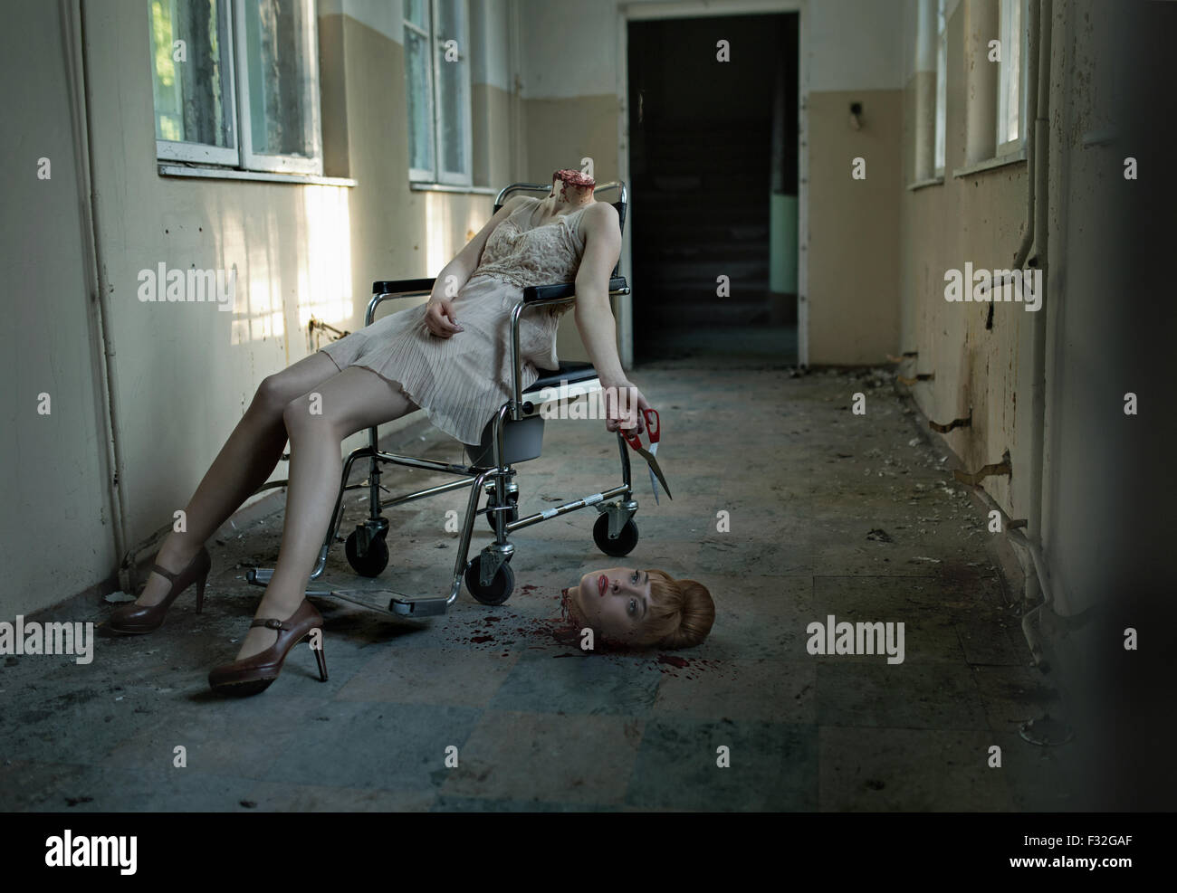 Art photo of the patient with cut head in the haunted hospital Stock Photo