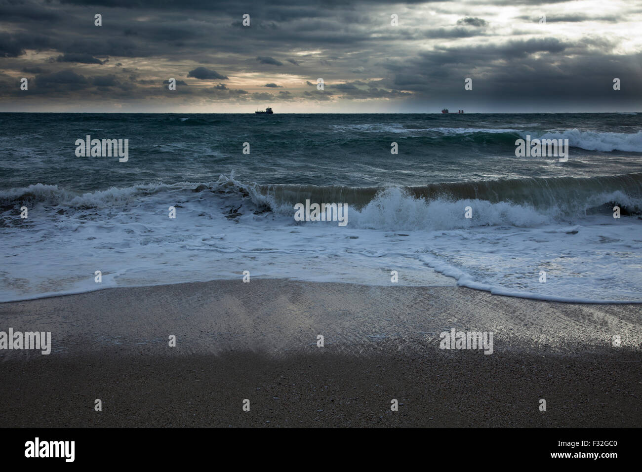 Cargo ships on the horizon Stock Photo - Alamy