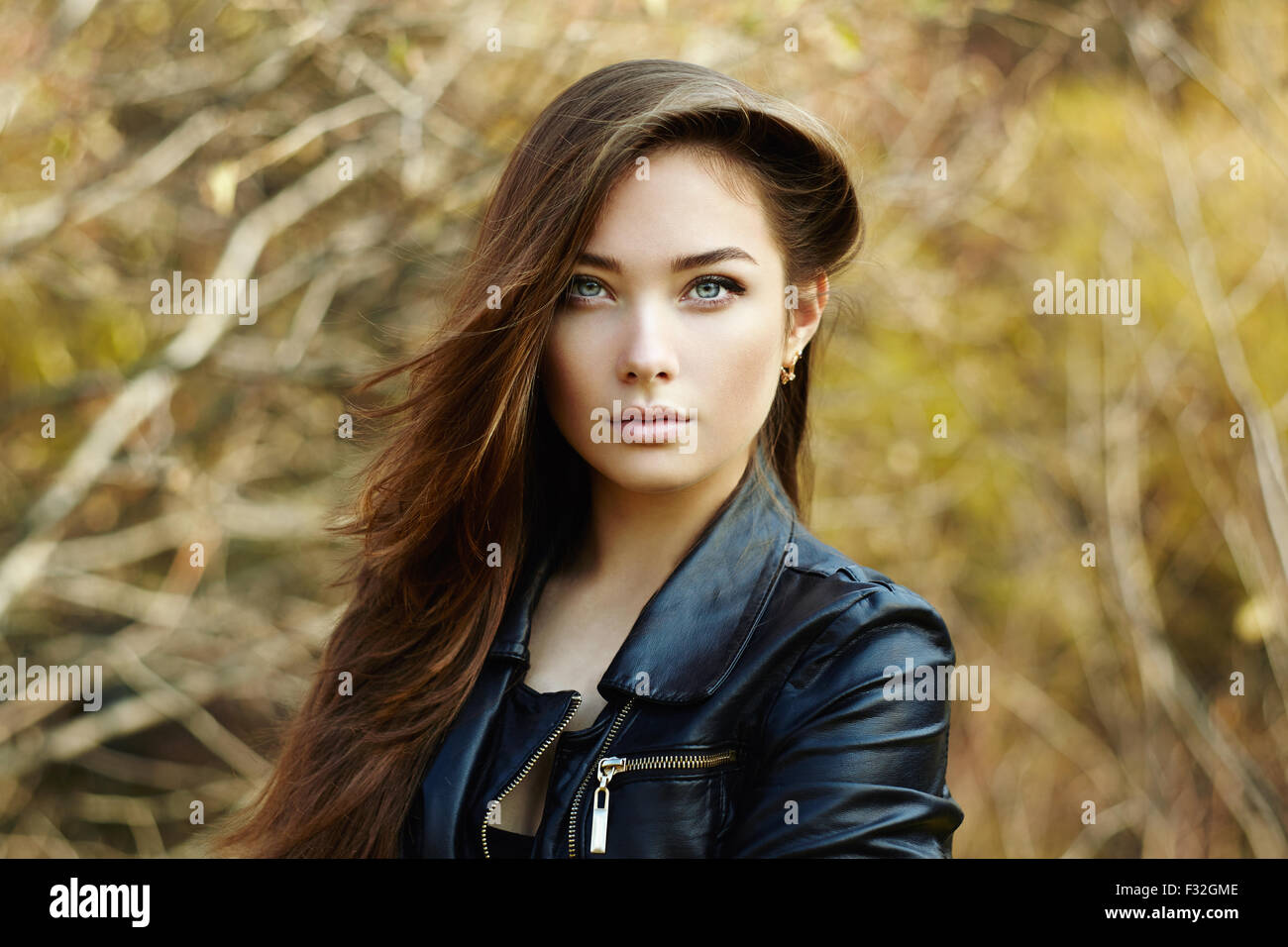 Portrait of young beautiful woman in leather jacket. Fashion photo ...