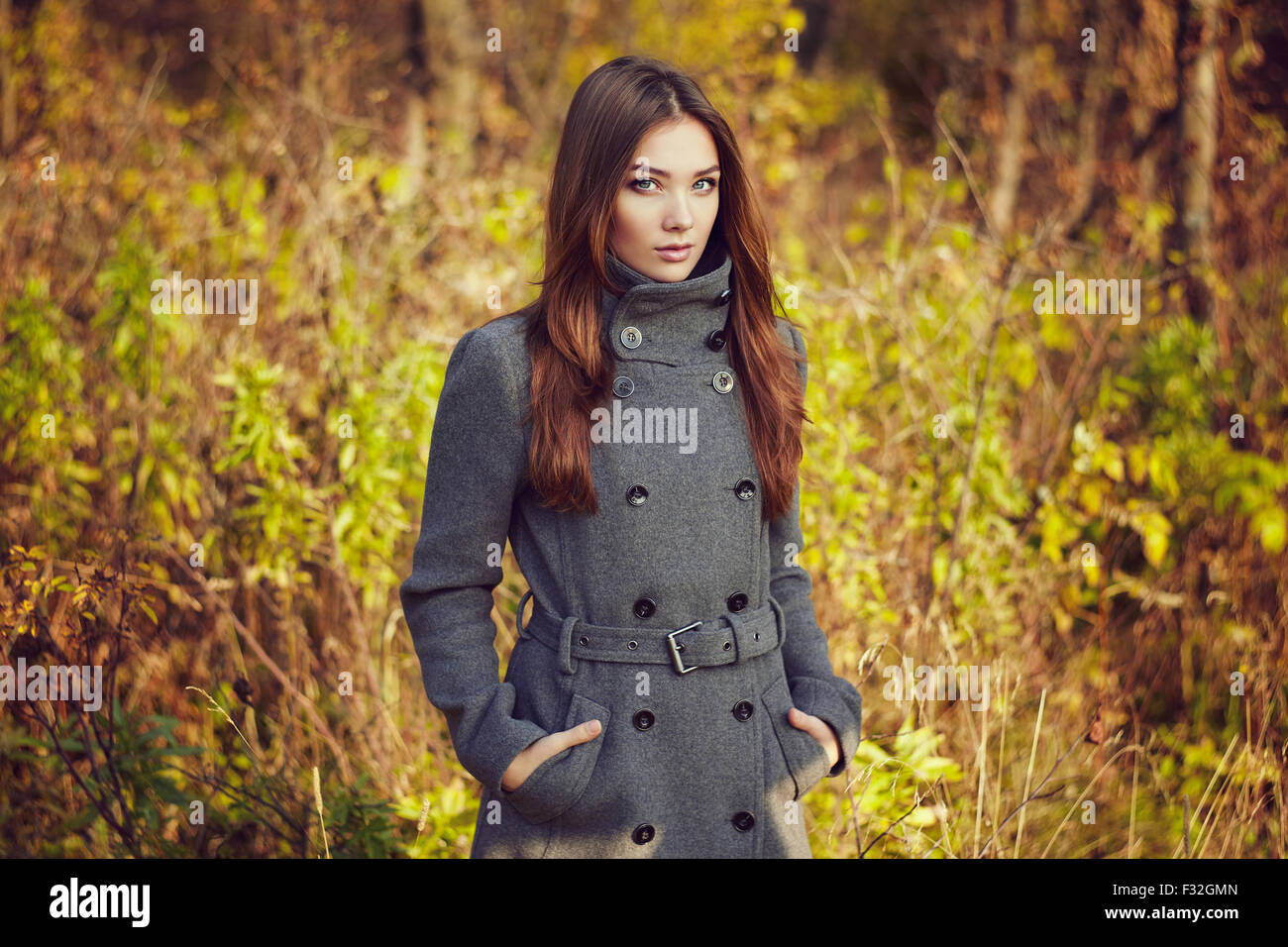 Portrait of young beautiful woman in autumn coat. Fashion photo Stock ...