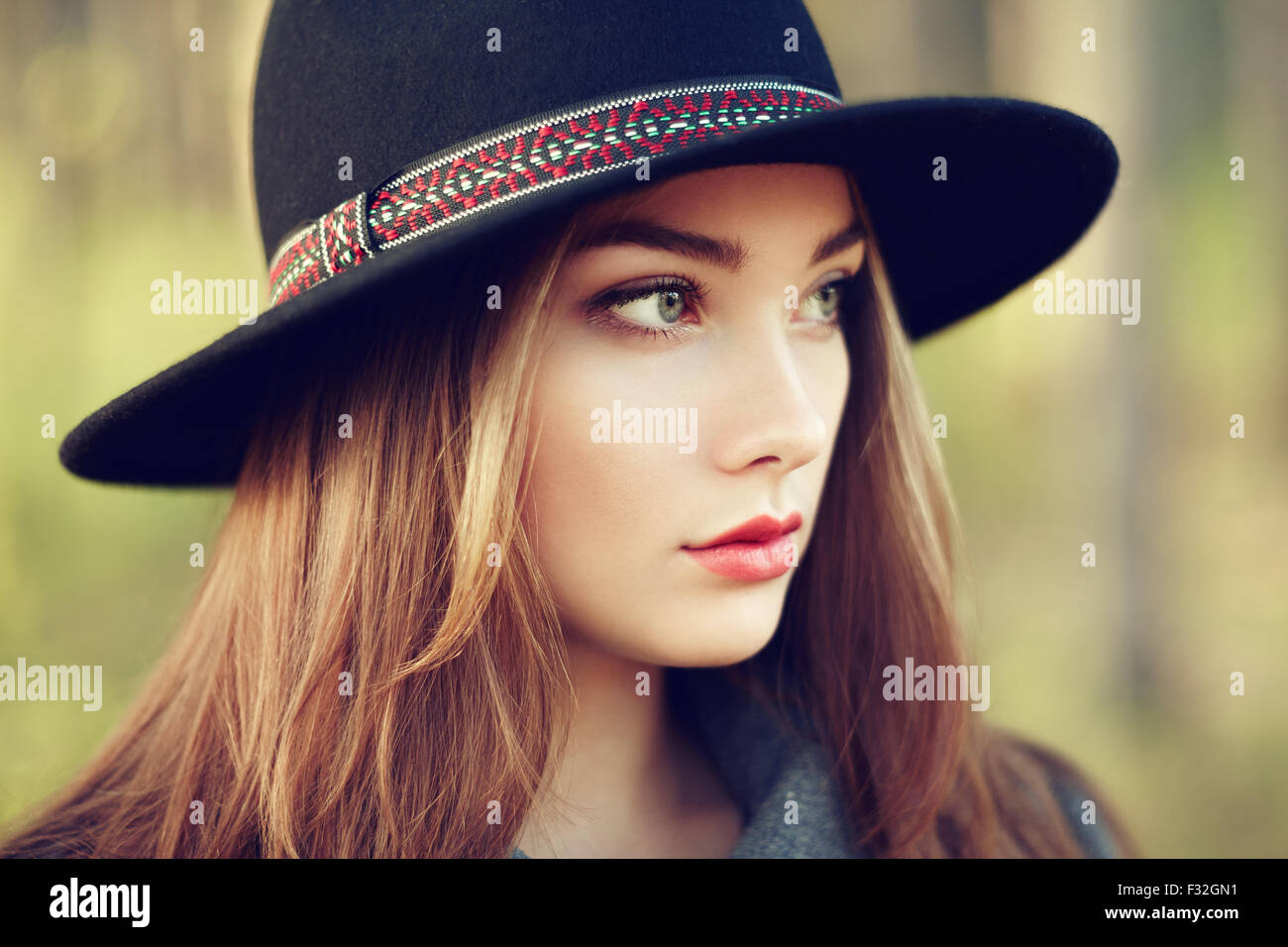 Portrait of young beautiful woman in autumn coat. Girl in hat. Fashion photo Stock Photo