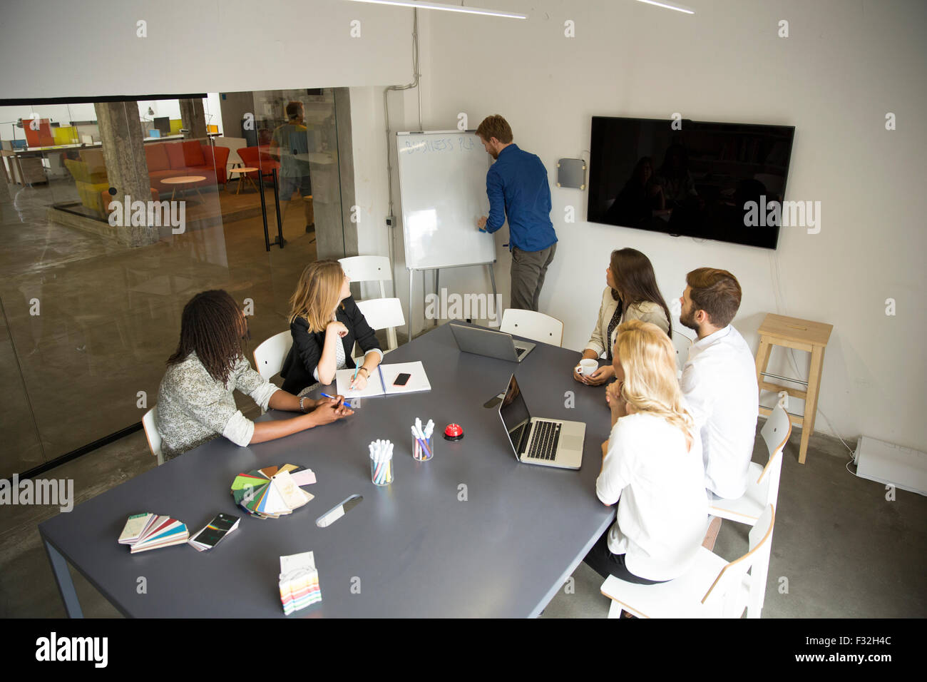 Young people in the office Stock Photo - Alamy